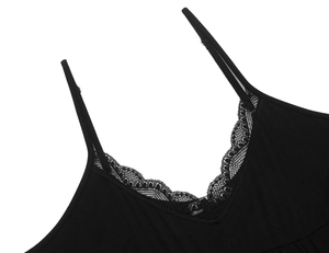 Close-up of elegant V-neckline with delicate black lace trim on modal nightgown
