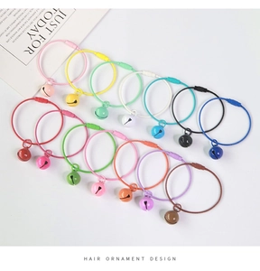Close-up of candy-colored steel wire keychains with matching bells in various macaron colors
