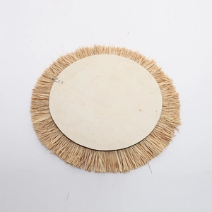 Back view of handmade round raffia wall mirror with wooden board and metal hook