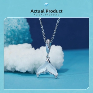 S925 silver fishtail pendant with opal and zircons on deep blue ocean background