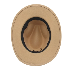 Top view detail of camel wool felt western hat interior with black sweatband and label
