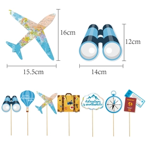 Travel theme party cake toppers featuring vintage suitcases, planes, and world map designs