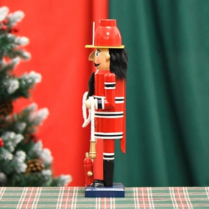 36cm wooden firefighter nutcracker figurine standing against a festive Christmas background