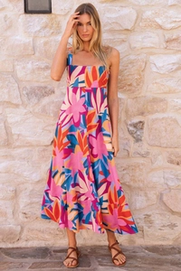 Close-up of floral print summer maxi dress with vibrant pink and blue patterns