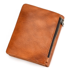 Close-up of brown genuine leather bifold wallet with litchi texture and side zipper pocket