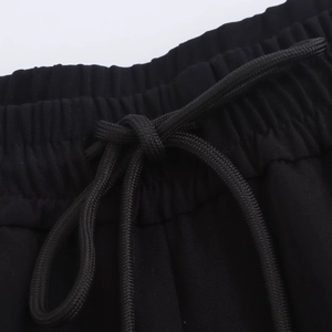 Women's black casual tracksuit with elastic waistband and braided drawstring details