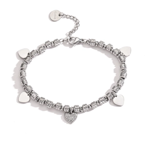 Macro shot of silver heart charm bracelet in stainless steel with sparkling zircon stone