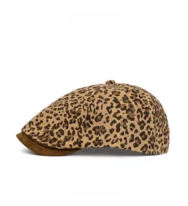 Detail view of American vintage leopard print newsboy cap with brown contrast visor