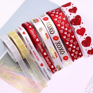 Detail of assorted Valentine ribbons featuring gold foil hearts and XOXO prints