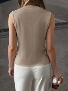 Beige ribbed knit sleeveless turtleneck vest for women in a slim fit stylish design