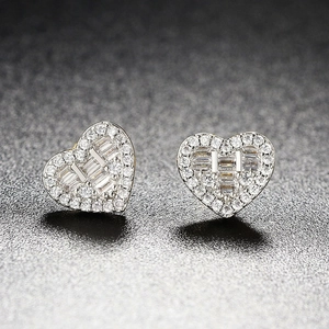 Sparkling iced-out heart stud earrings with baguette-cut and round-cut diamonds