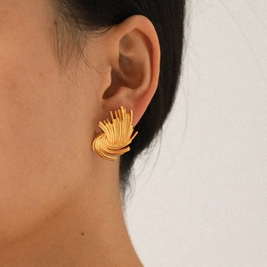 Artistic gold woven fan-shaped stud earrings in 18K gold-plated stainless steel on model