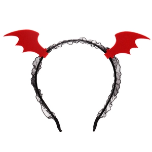 Detail of Halloween headband featuring red devil wings and black lace trim on white base