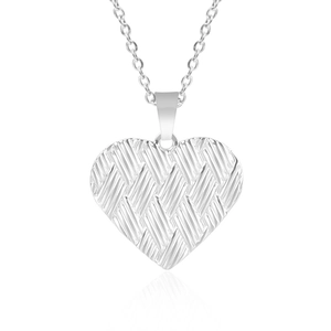Close-up of silver stainless steel heart pendant with intricate woven texture on chain