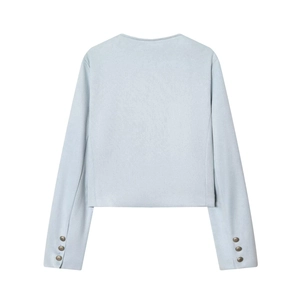Close-up of minimalist light blue cropped jacket featuring decorative sleeve cuff buttons