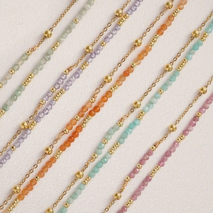 Bohemian double-layered bracelet featuring colorful natural stone beads and gold metal links