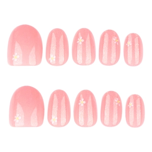 Pink glitter press-on nails with white floral pattern and rounded oval shape