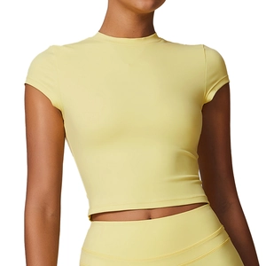 Slim fit pale yellow yoga crop top with high waist shorts set for women's fitness workout