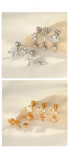 Macro shot of gold and silver surgical steel ear studs with sparkling cubic zirconia crystals