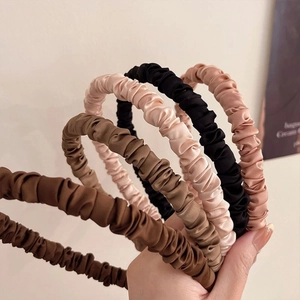 French pleated satin headband collection in earthy tones for high cranial top style