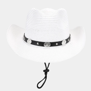 Detail of white straw cowboy hat with black decorative band and silver metal buckle