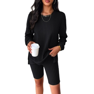 Women's black knit two-piece set featuring long-sleeve top and shorts for casual wear