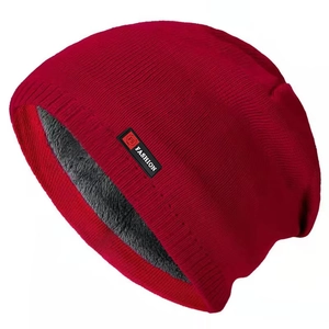 Thick warm winter beanie hat with fleece lining and fashion patch in deep red color