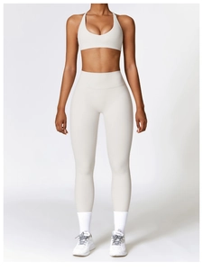 Close-up of cream white high-waisted yoga pants and racerback sports bra set