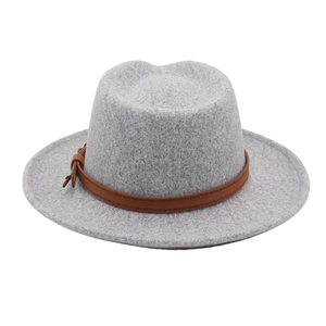 Detail view of grey wool fedora hat featuring a brown leather decorative band with buckle