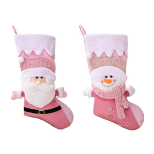 Pink plush Nordic Christmas stockings with Santa and Snowman patterns on white background