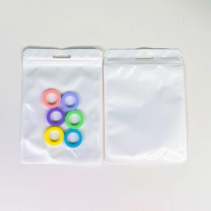 Colorful round ring jewelry set inside thick macaron holographic resealable bags