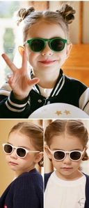 Close-up of green and white silicone sunglasses for babies with retro round lenses