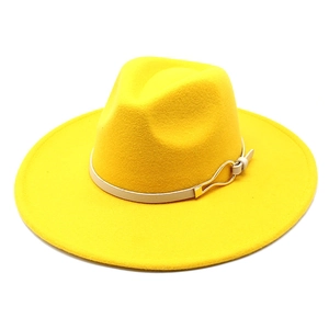 Detailed macro view of bright yellow wool fedora featuring slim leather band and golden buckle