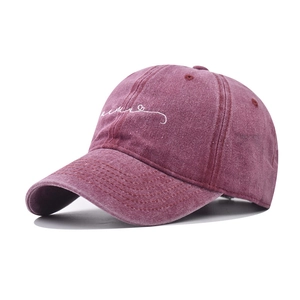 Detailed embroidery on vintage washed cotton baseball cap showing texture and stitching