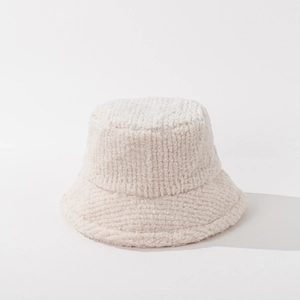 Detailed texture of thick cream lamb wool plush bucket hat for winter warmth