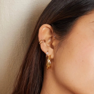 Minimalist double layer 18k gold ear cuff and earring set on female model ear