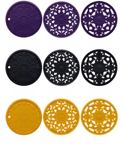 Detailed grid of heat-resistant silicone placemats in lotus and daisy patterns