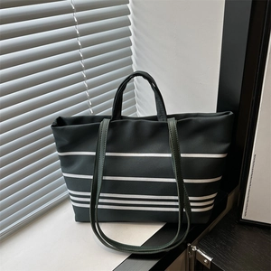 Deep green striped canvas tote bag with dual straps and spacious minimalist design