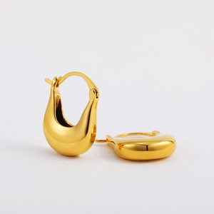 Polished 18K gold teardrop earrings with a thick U-shaped geometric design on white background