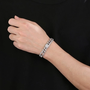 Macro shot of silver hip hop Cuban link bracelet with sparkling pave white zircons on model