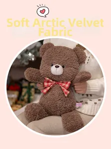 Detailed close-up of fluffy arctic velvet teddy bear with a plaid ribbon bow accessory