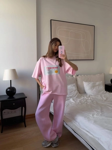 Pink lounge set featuring loose-fit letter print t-shirt and matching jogger pants