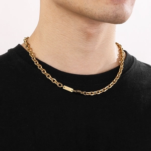 Close-up of a gold-plated titanium steel chain necklace with a smooth rectangular pendant