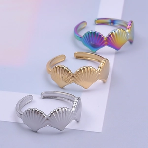 Minimalist stainless steel shell rings in gold, silver, and iridescent finishes