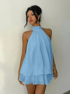 Detail of light blue halter chiffon mini dress with layered ruffle hem and pleated neck