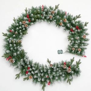9ft Christmas garland with snowy needles, red berries, and pinecones for holiday decor