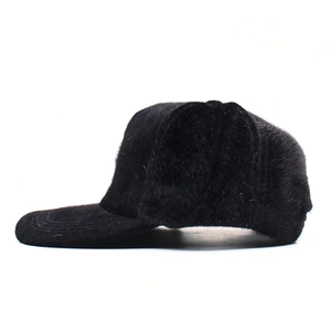 Women's warm black faux fur baseball cap featuring a stylish plush texture for winter