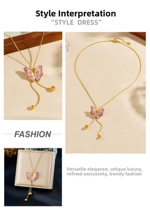Detailed view of a gold-plated necklace with a purple gradient butterfly pendant and tassels