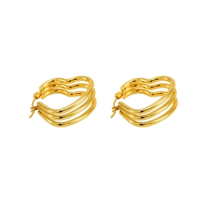 Macro detail of golden triple-layered wavy hoop earrings with a polished metallic finish