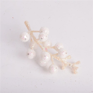 Close-up of white glitter artificial berry stems for DIY Christmas wreath decoration